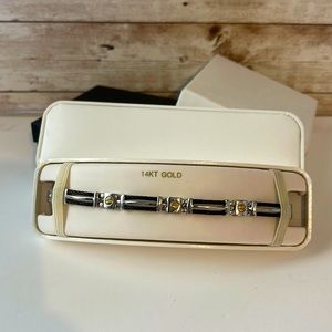 Fine piece with black, silver and 14k gold